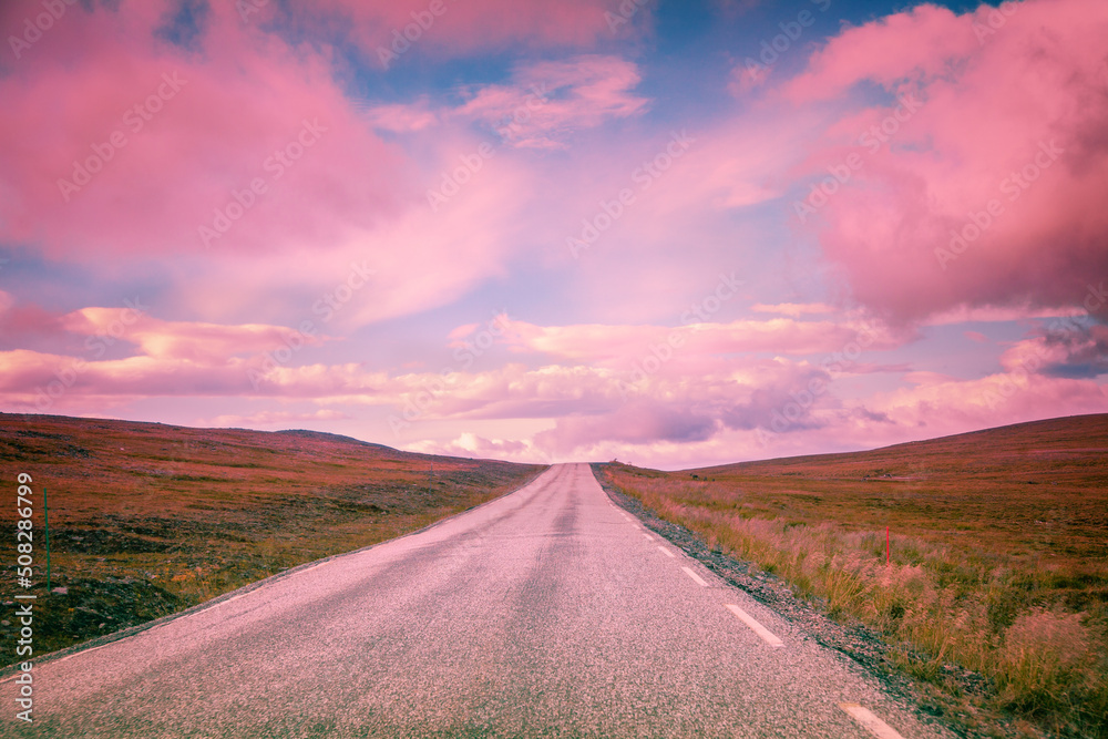 Fototapeta premium Driving a car on mountain road. Beautiful harsh nature of Northern Norway. Polar circle. The way to Nordkapp