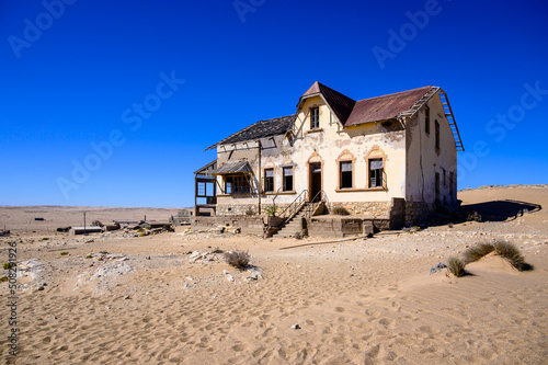 abandoned house filled with desert sand in kolmanskop,namibia