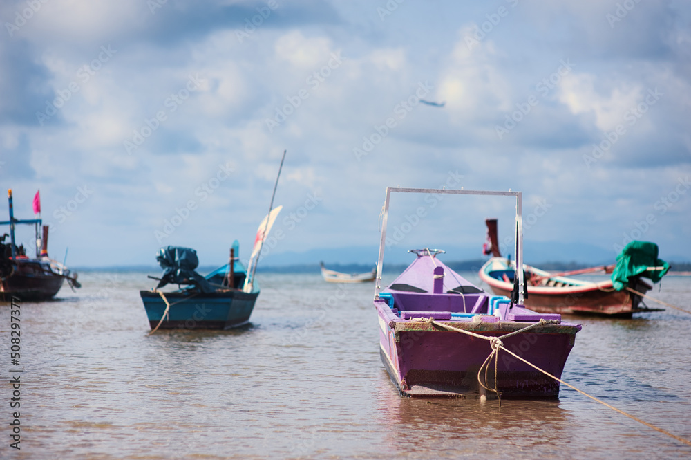 Travel by Thailand. Seascape with traditional fishing boats.