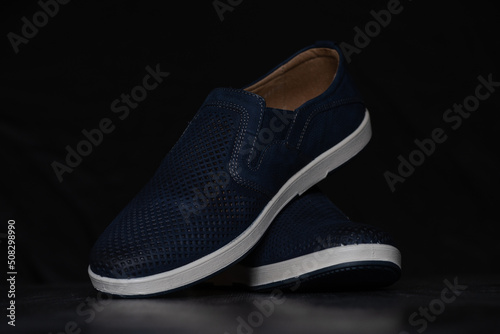 Men's summer shoes made of natural nubuck blue, with a white sole.