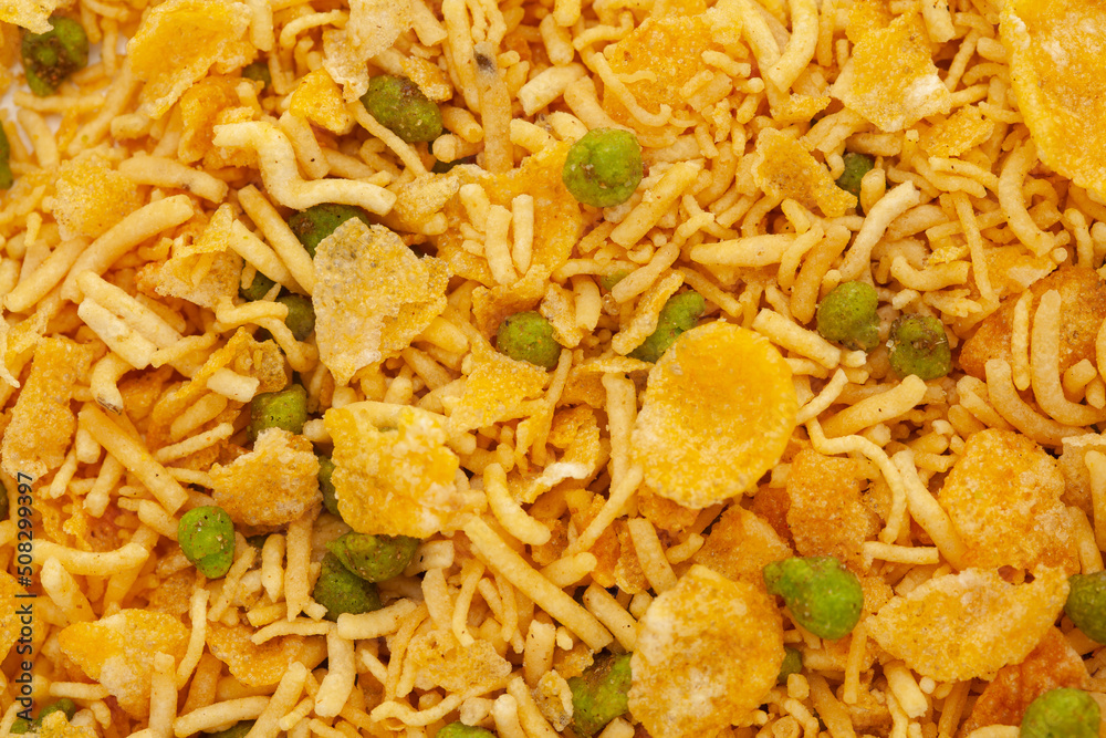 Crunchy Diet Mixture full-frame wallpaper, made with Puffed Rice, Corn Flakes, and Curry leaves. Indian spicy snacks (Namkeen) Crunchy Diet Mixture full-frame wallpaper, made with Puffed Rice, Corn Flakes, and Curry leaves. Indian spicy snacks (Namkeen)