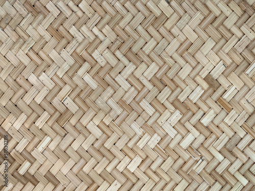 Woven pattern. Natural wood weave background. Oriental style woven material. Bamboo weaving mat.