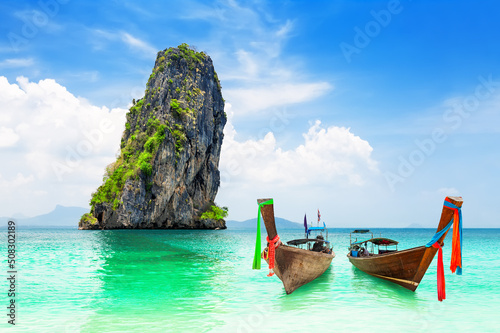 Beautiful beach of Koh Poda island with thai traditional wooden longtail boat in Krabi province, Thailand.