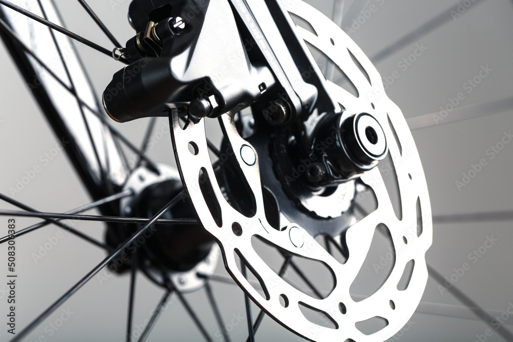 Fototapeta premium Bicycle brake rotor with hydraulic caliper. Brake system on a gravel bike