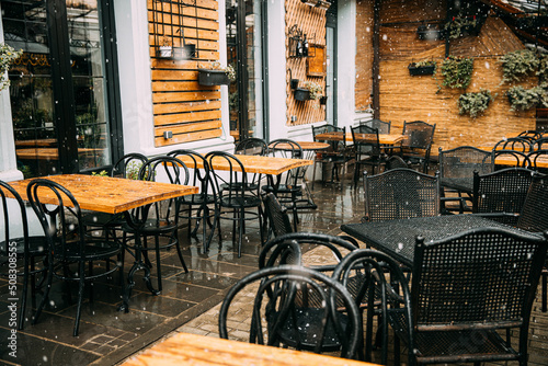 Tables, empty cafe during bad cold weather. nobody in Cafe. Free 