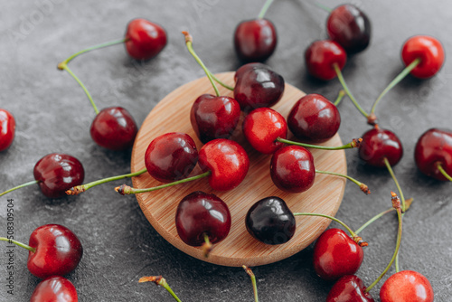Organic cherry, farm fresh fruits on farmer table