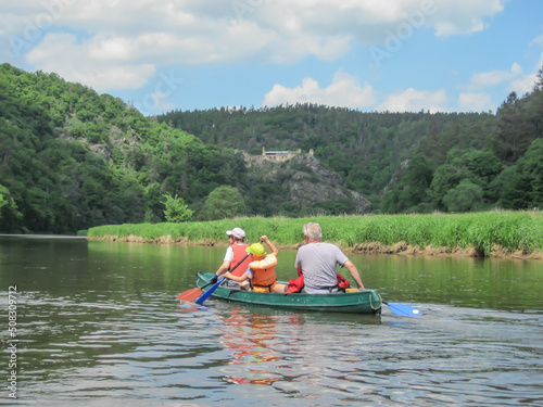 Canoeing on the river, grass, forest