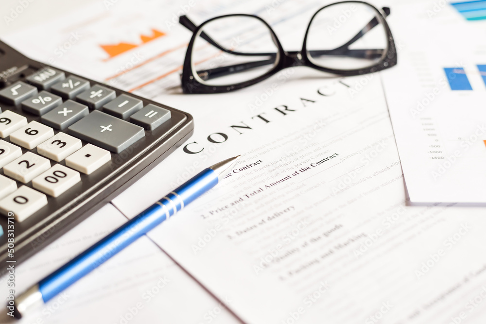 business graph, sales report, calculator, pen and glasses, top view business graph, sales report, calculator, pen and glasses, top view