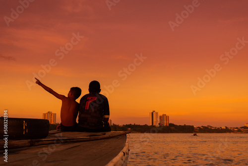 Garotos em embarcação no Rio Tocantins, Imperatriz - Maranhão photo