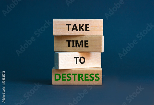 Take time to destress symbol. Concept words Take time to destress on wooden blocks. Beautiful grey table grey background. Psychological business and take time to destress concept. Copy space.