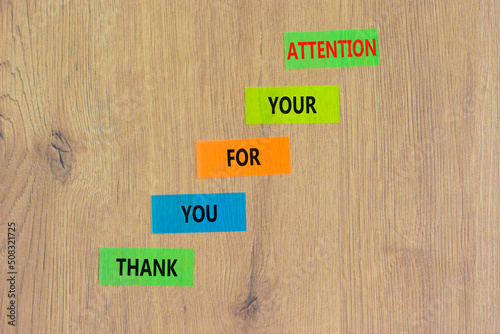 Thank you for attention symbol. Concept words Thank you for your attention on colored paper on a beautiful wooden table wooden background. Copy space. Business and thank you for attention concept.