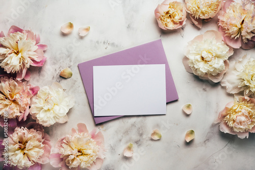 Beautiful background with peony flowers and empty card for text. Floral background © Katecat