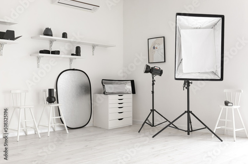 Lighting equipment in modern photo studio