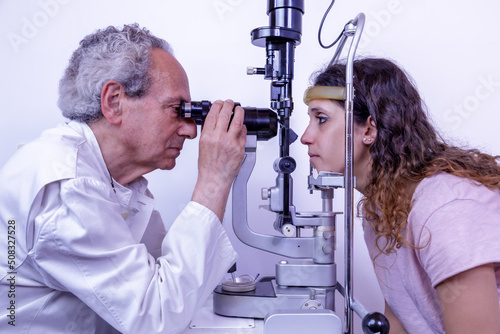 Eye medical examination. Eye doctor visits the patient using a special tool. Pachymetry is a diagnostic test that allows measurement of the thickness of the cornea. photo