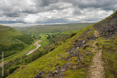 On the Coast to Coast long distance footpath walk at Muker in Swaledale in the Yorkshire Dales