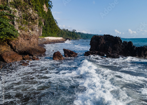 Beautiful views of the coast of the island of sao tome and prince. High waves crashing against the rocks.