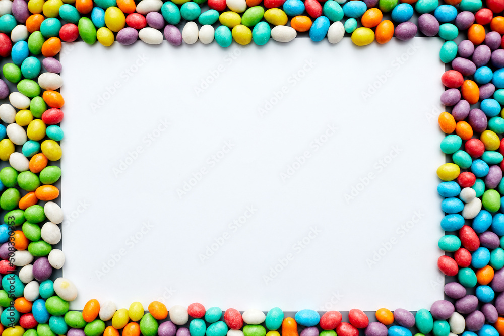 Jelly bean frame with blank paper sheet, copy space Jelly bean frame with blank paper sheet, copy space