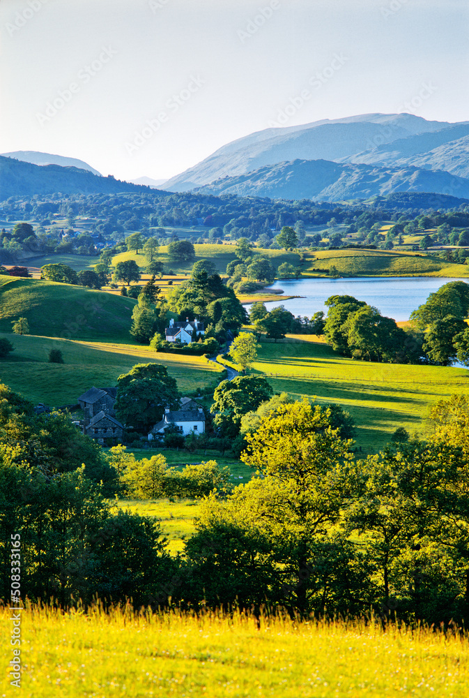 N. over W. shore of Esthwaite Water near Hawkshead toward Helvellyn and Fairfield in the Lake District National Park, England.