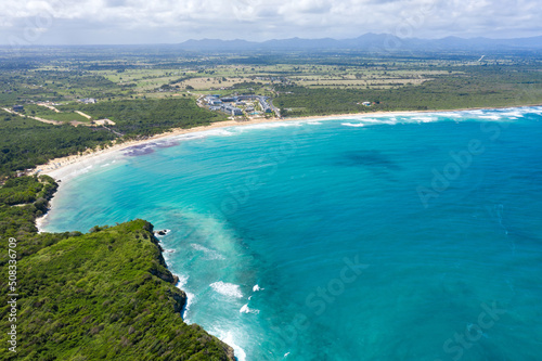 Stone cliff washes with Atlantic ocean. Macao beach. Dominican Republic. Aerial view
