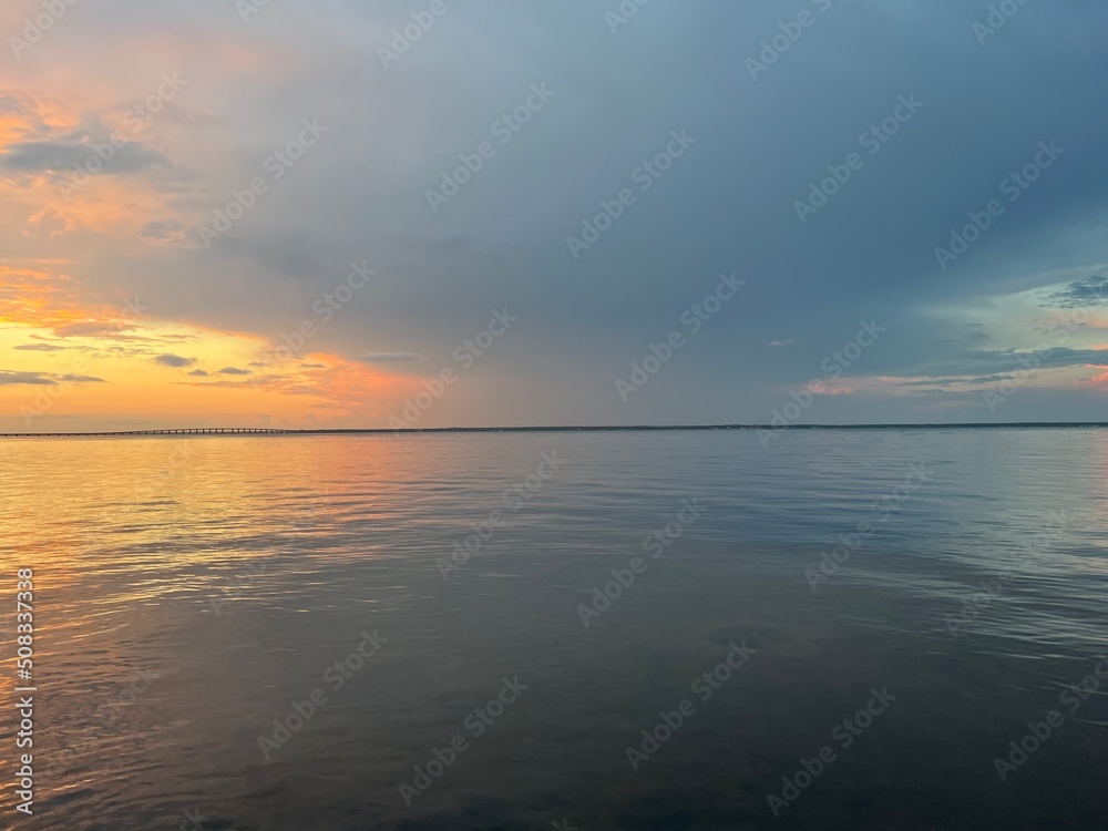 sunset over bay water