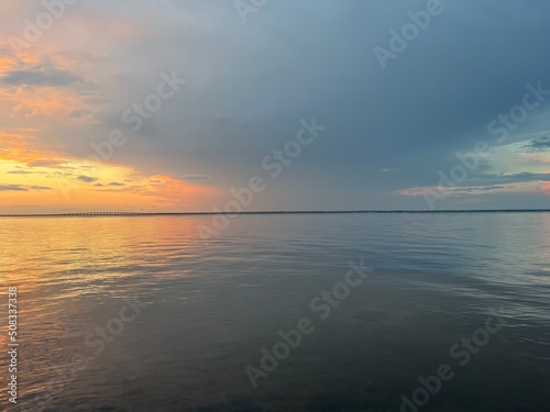 sunset over bay water