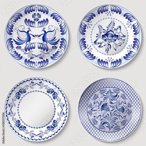Set of porcelain plates. Blue pattern on white in oriental asian style. Cobalt painting style on ceramic. Floral ornament with Chinese design motifs. Decorative dish isolated.