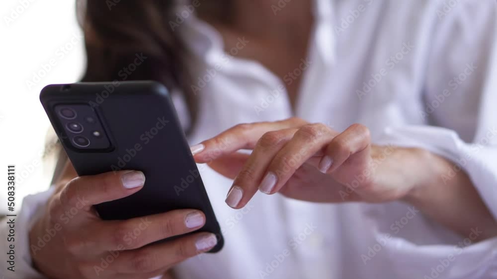 young woman looking and touching smart mobile phone. touching smart mobile phone reading social network woman messaging to internet online, communication concept. young woman looking and touching smart mobile phone. touching smart mobile phone reading social network woman messaging to internet online, communication concept.