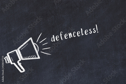 Chalk sketch of loudspeaker and inscription defenceless