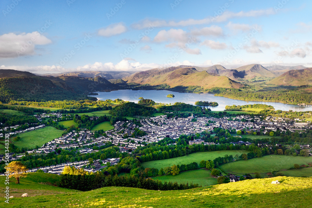 Lake District National Park, Cumbria, England. South over Keswick town and Derwentwater to Borrowdale. Summer morning