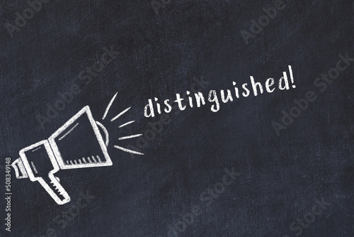 Foto Chalk loudspeaker and inscription distinguished on black chalkboard