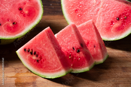 fresh sliced watermelon fruit on wooden background