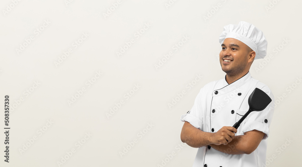 Young handsome asian man chef in uniform standing with turner kitchen utensils various gesture action on isolated background. Cooking man Occupation chef People in kitchen restaurant and hotel.