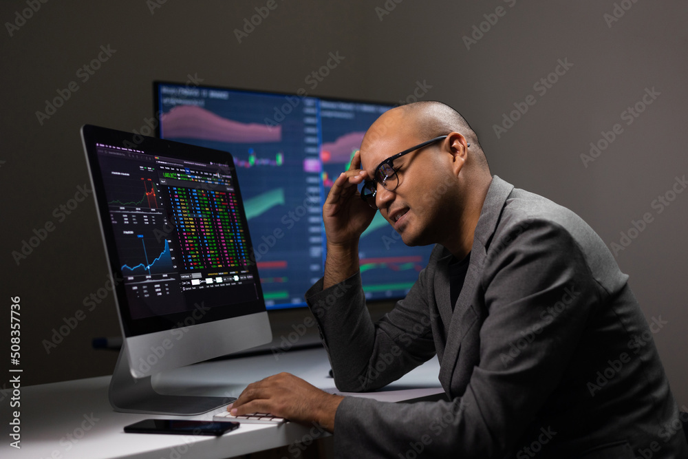 Financial losing moment with exchange rate diagram on smartphone at night. Investor businessman analyzing a graphic of a stock cryptocurrency exchange chart with cell phone. Investment concept Financial losing moment with exchange rate diagram on smartphone at night. Investor businessman analyzing a graphic of a stock cryptocurrency exchange chart with cell phone. Investment concept