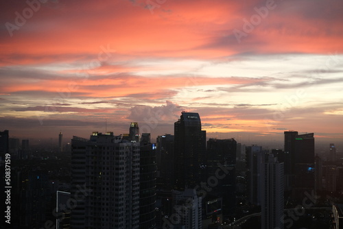 Jakarta city viewed from the top and at sunset