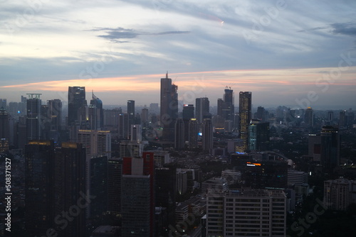 Jakarta city viewed from the top and at sunset