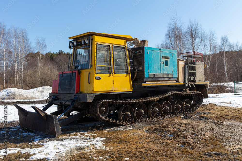 Diesel Crawler compressor on a sunny spring day Diesel Crawler compressor on a sunny spring day