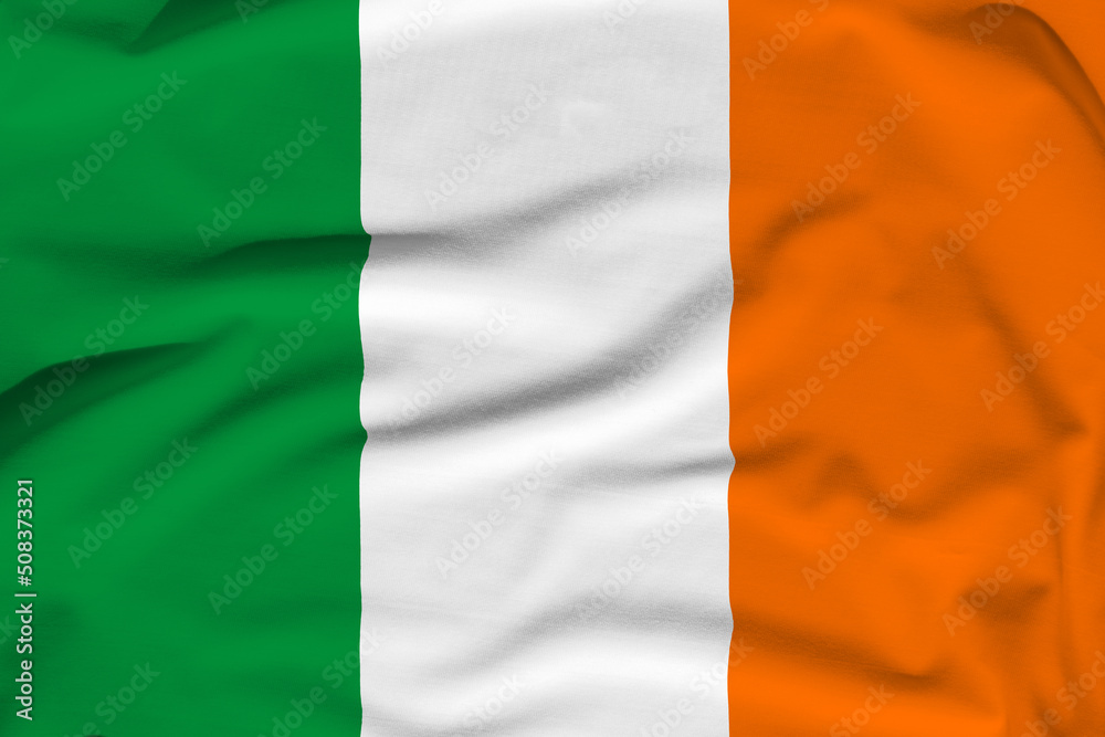 Ireland national flag, folds and hard shadows on the canvas