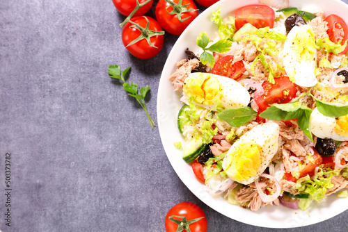 rice salad with egg, tuna, olive and tomato