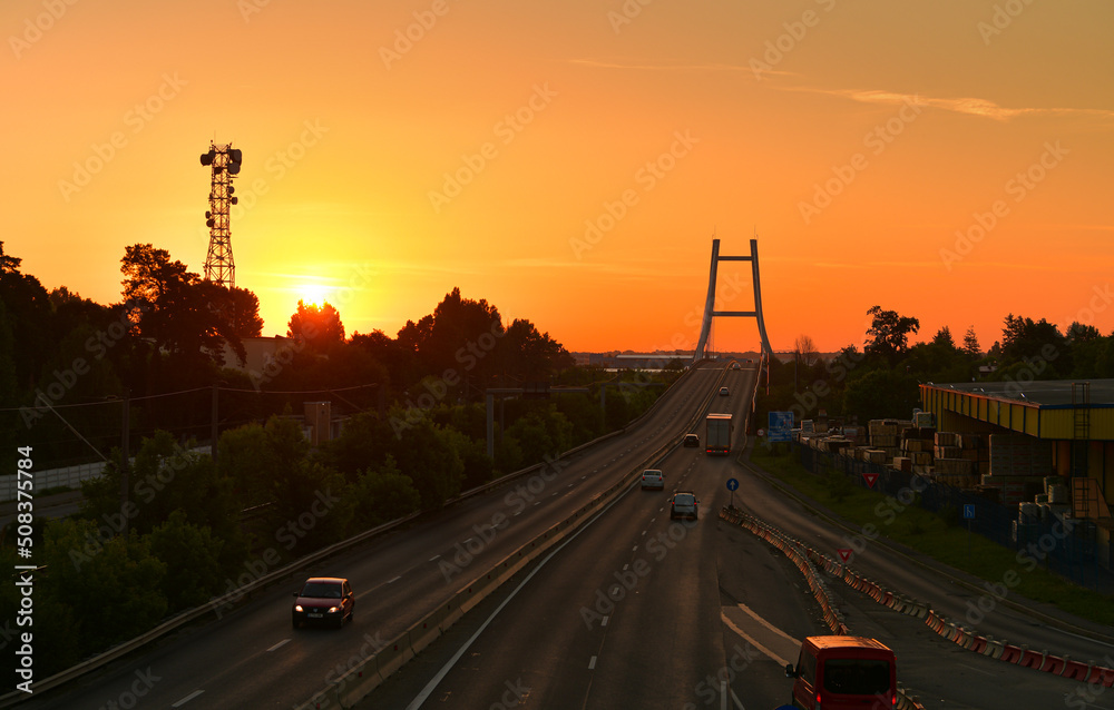 Sunrise over Otopeni Bridge, next to the ring road of Bucharest (Centura Bucuresti). Transportation industry, roads of Romania, 2022.