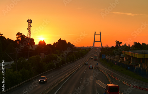 Sunrise over Otopeni Bridge, next to the ring road of Bucharest (Centura Bucuresti). Transportation industry, roads of Romania, 2022. photo