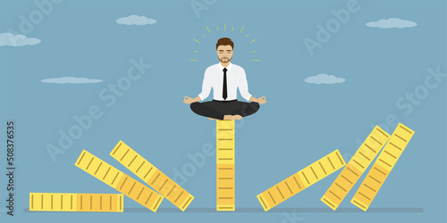 Risk management. Economic crash, financial collapse. Businessman meditating for relax. Reduce stress, eliminate distraction. Confident male manager meditating in lotus yoga pose on domino.