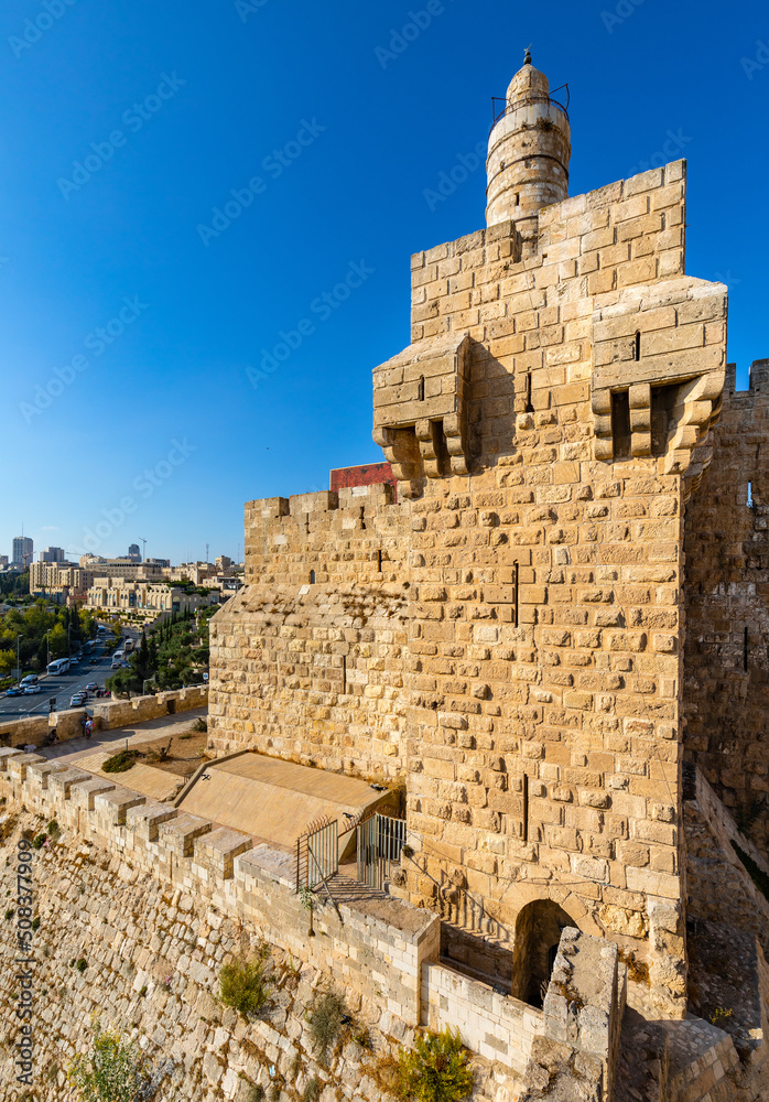 Ottoman minaret above walls and archeological excavation site of Tower Of David citadel stronghold in Jerusalem Old City in Israel