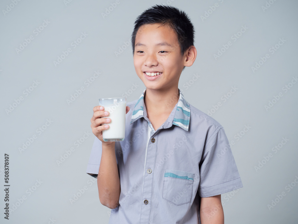 Little boy with glass of milk