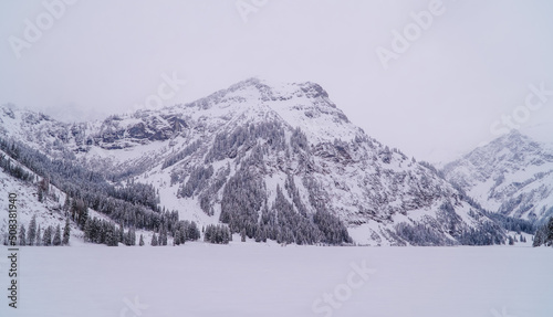 Panorama view of the frozen Visalpsee near Tannheim, Austria