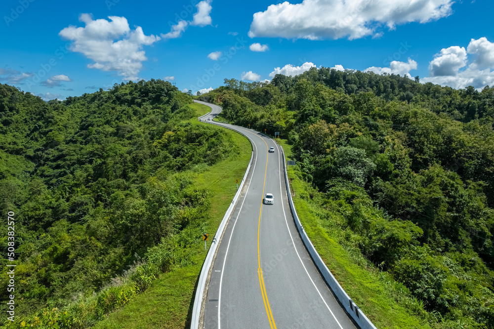 Fototapeta premium The zigzag road is similar to the number 3. This road is built on a mountain, past the forest in Nan, Thailand, so it will have good scenery, be famous, and have tourists who come to take pictures.