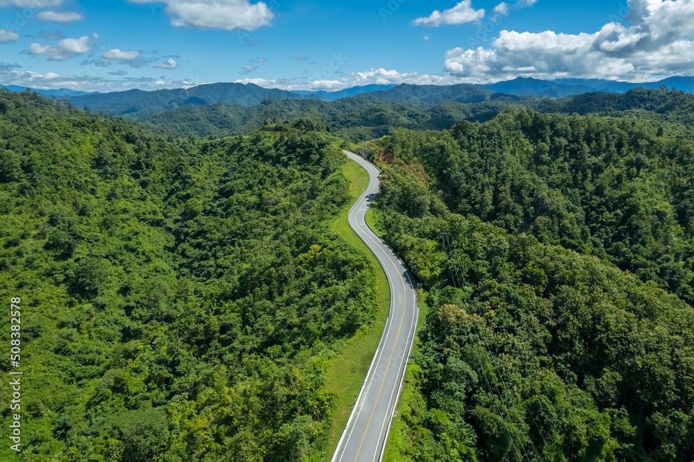 Fototapeta premium The zigzag road is similar to the number 3. This road is built on a mountain, past the forest in Nan, Thailand, so it will have good scenery, be famous, and have tourists who come to take pictures.