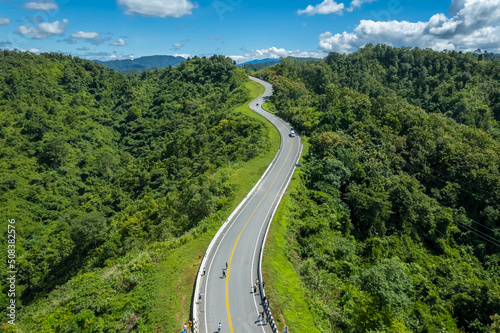 The zigzag road is similar to the number 3. This road is built on a mountain  past the forest in Nan  Thailand  so it will have good scenery  be famous  and have tourists who come to take pictures.