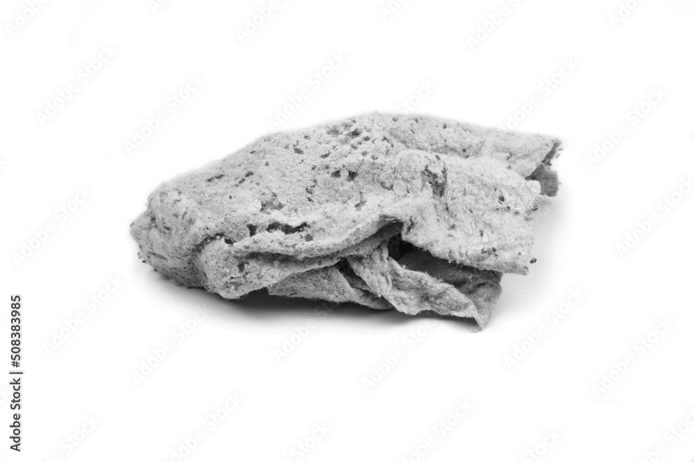 Old dirty torn rag isolated on white background. Cleaning rag. Old dirty torn rag isolated on white background. Cleaning rag.