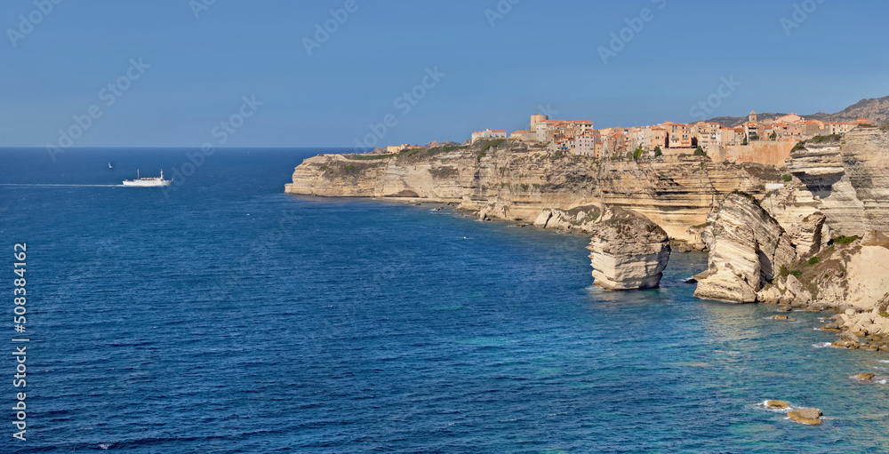 Bonifacio coastline with limestone cliff in the sea under clear blue sky in Corsica- France Bonifacio coastline with limestone cliff in the sea under clear blue sky in Corsica- France