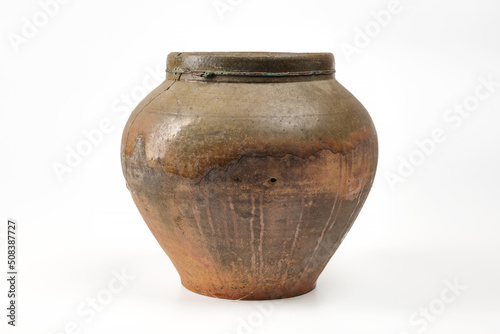 Vintage pottery, vase isolated on white background. Antique brown clay pot on white background.